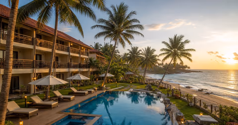 Coastal Murudeshwar resort with pool, beach access and palm trees at sunset